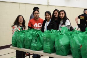 volunteers prepare bags for refugees