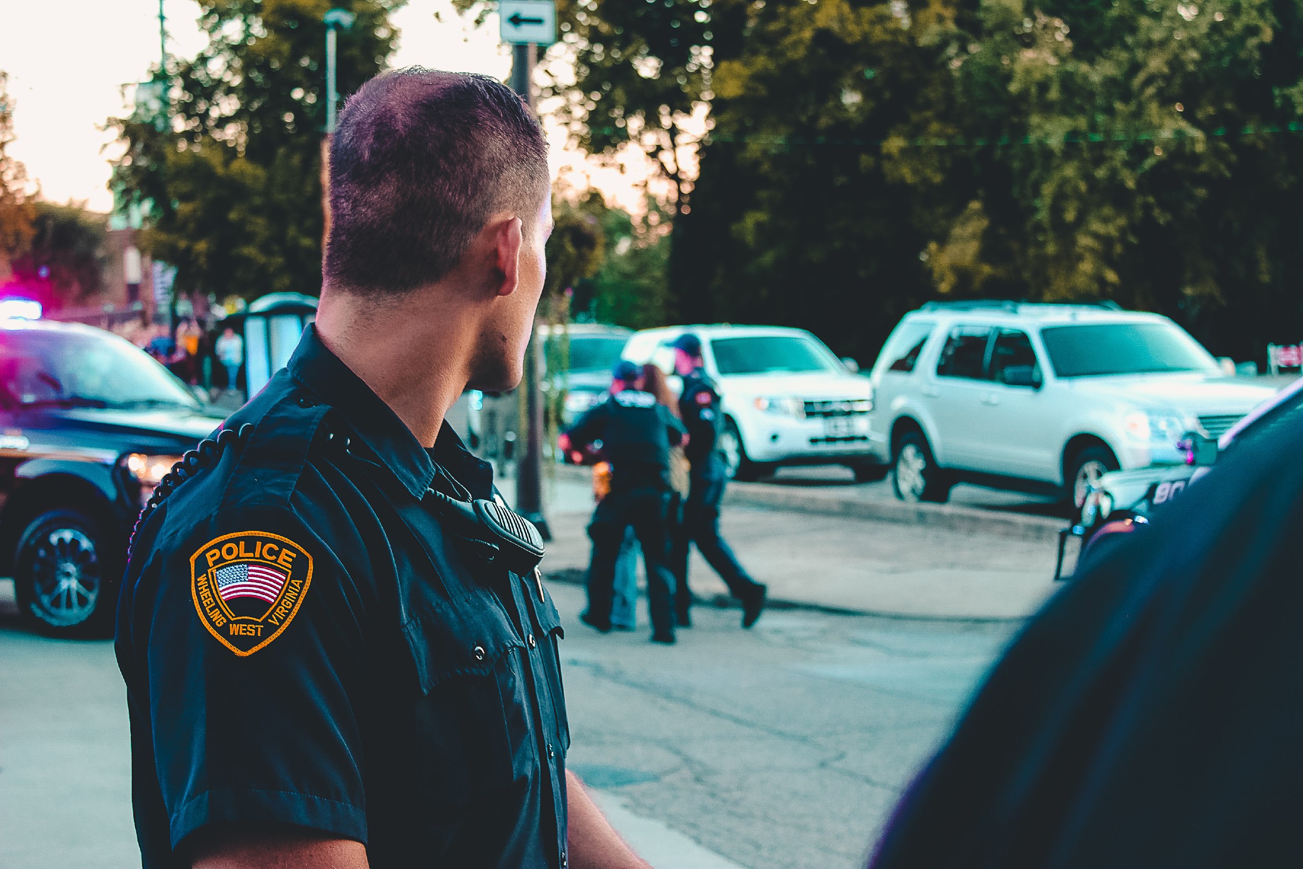 Police officer looking back at activity.